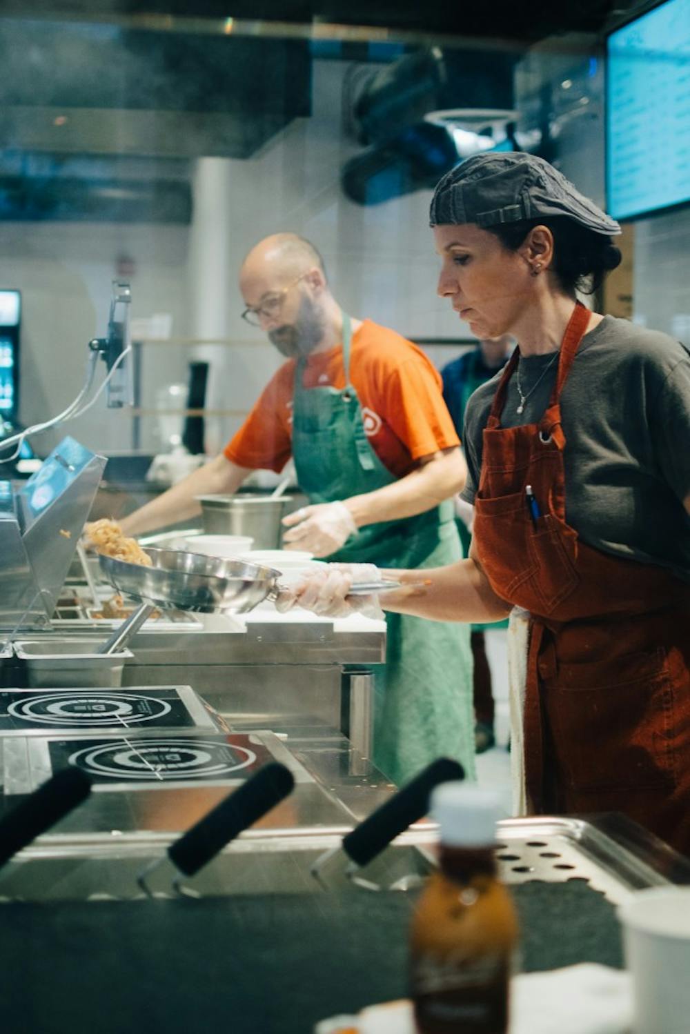Monica and Danilo preparing food at DaMò Pasta Lab